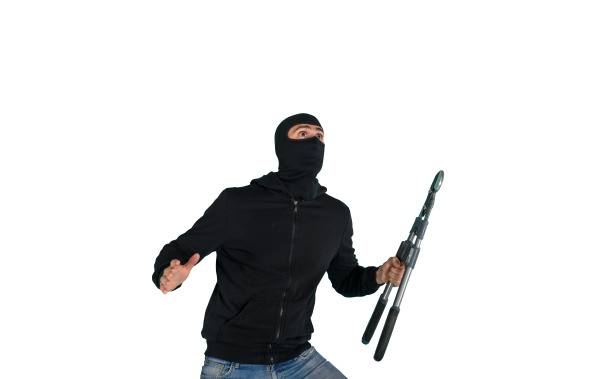 thief with balaclava acts in silence