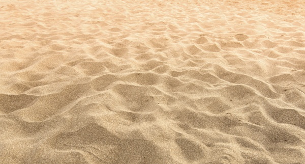 sand on the beach as background