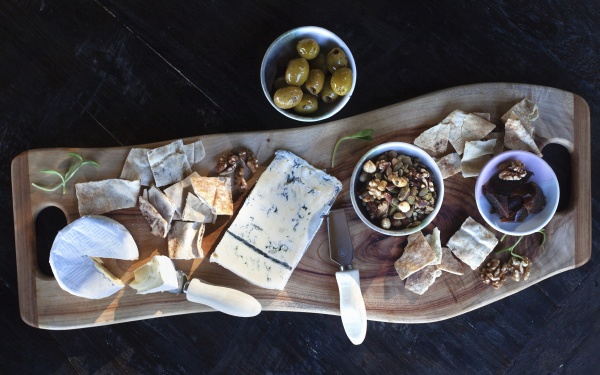a cheese platter with nuts