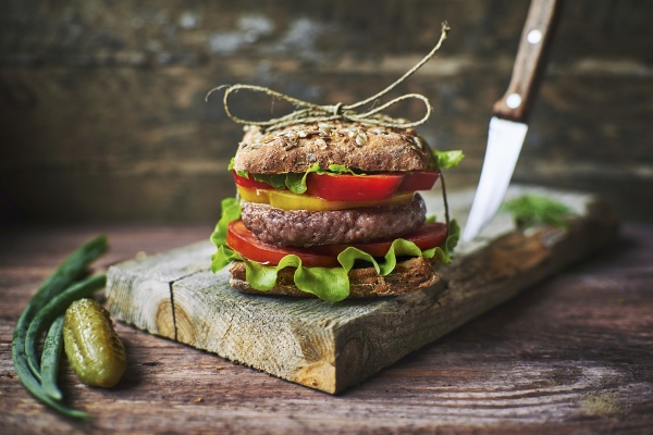 tasty fresh burger tied with linen