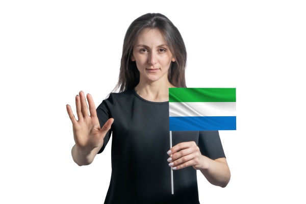 happy young white woman holding flag