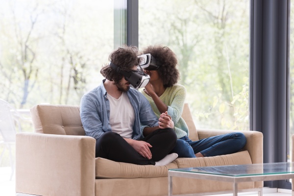 multiethnic couple using virtual reality headset