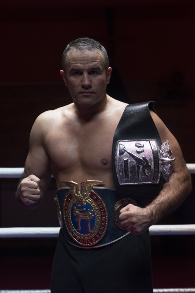 kick boxer with his championship belt