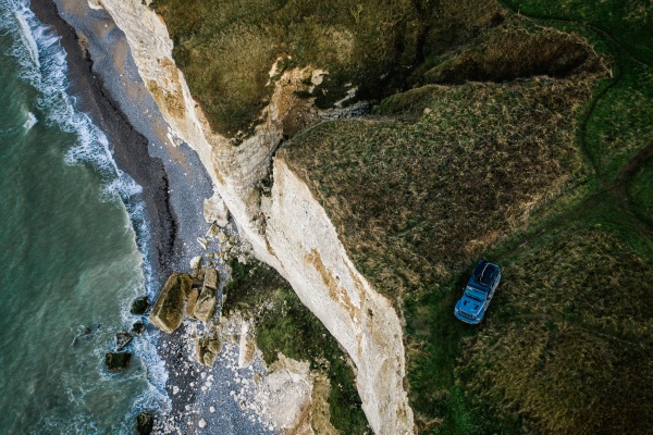 aerial view of car on cliff