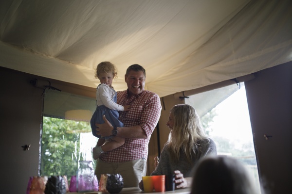 happy family in yurt cabin