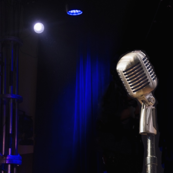 old fashioned microphone on empty stage
