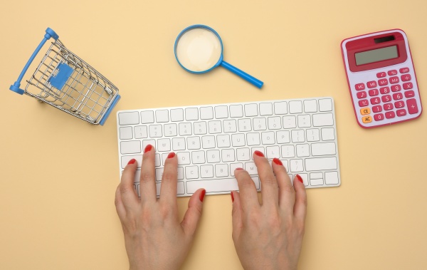 female hands and white wireless keyboard