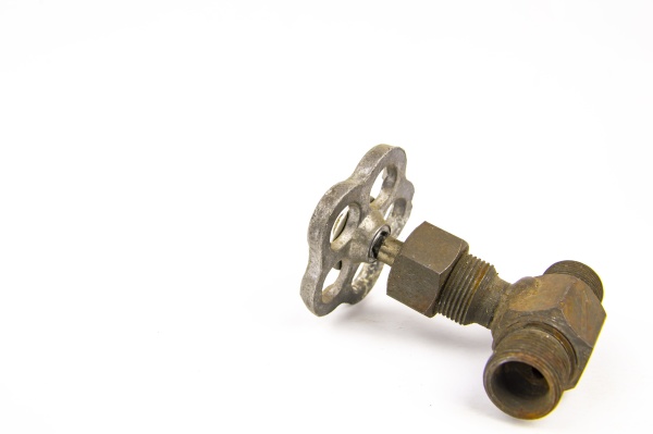 old water tap on white background
