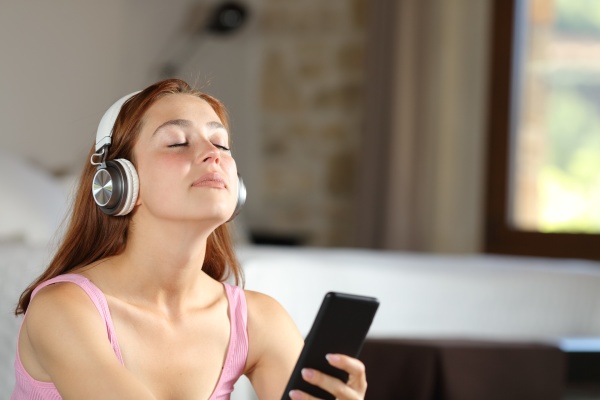 relaxed homeowner listening to music at