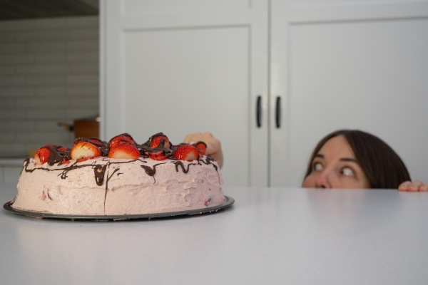 girl eating cake in the kitchen