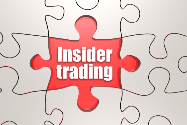 insider trading word on jigsaw puzzle