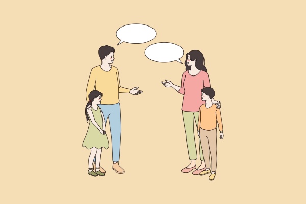 smiling parents of teen children talk