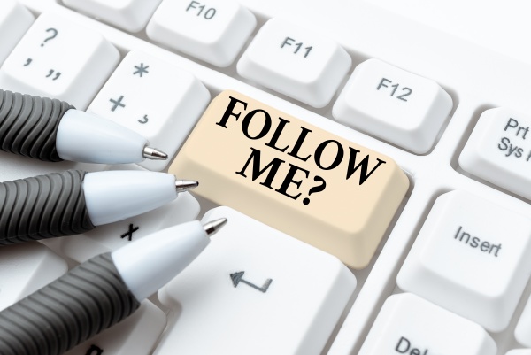 sign displaying follow me question