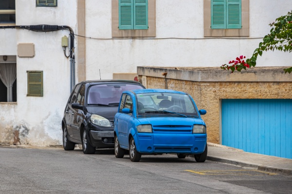 small funny blue car parked cala