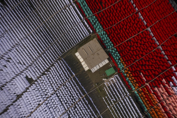 aerial view of workers hanging thousands