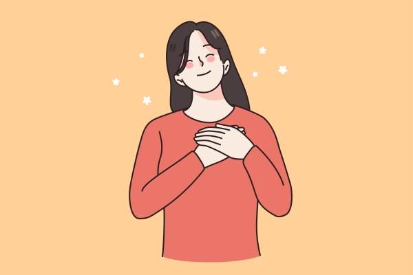 happy woman hold hands at chest