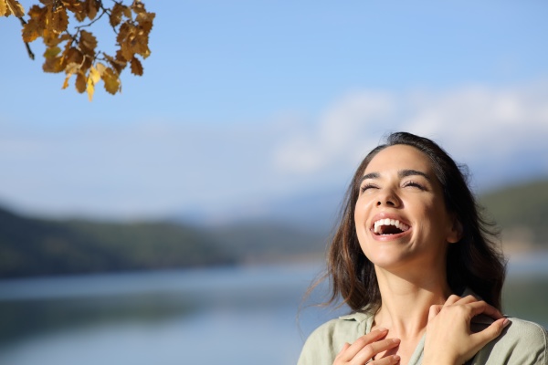 happy beauty woman laughing in nature