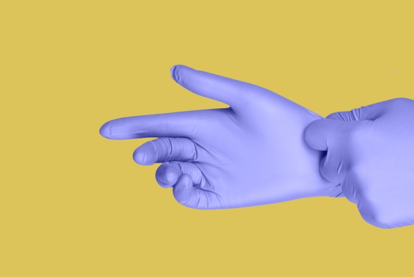 purple gloves on a hand on