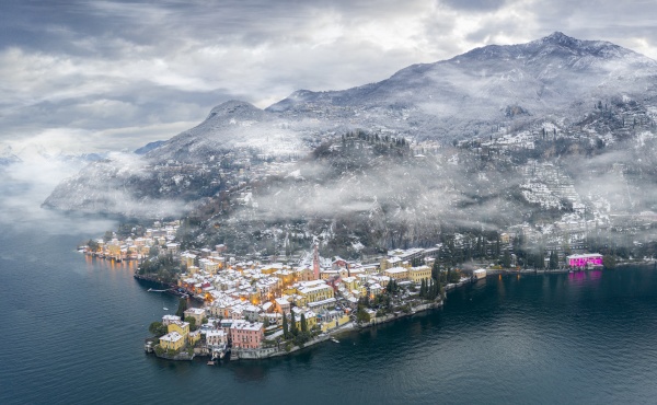 mist over varenna old town and