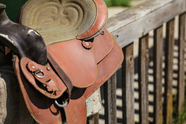 old worn leather horse saddle on