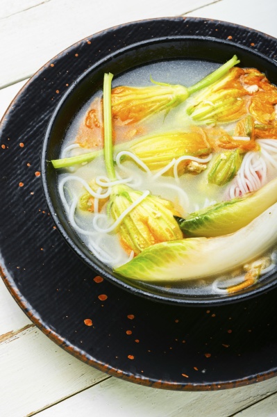 rice noodle soup with pumpkin flowers
