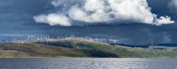 wind turbines under a stormy sky