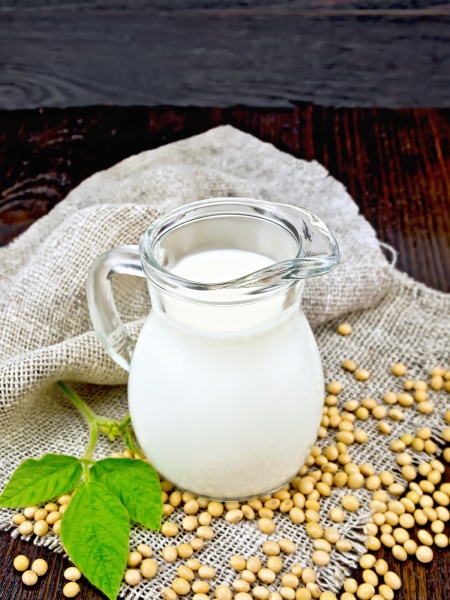 milk soy in jug with soybeans
