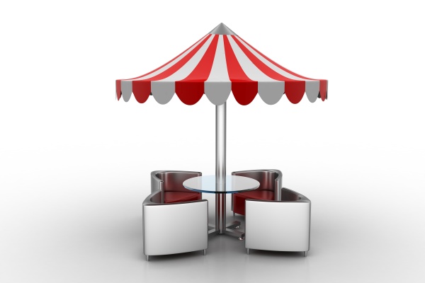 table and chairs under the umbrella