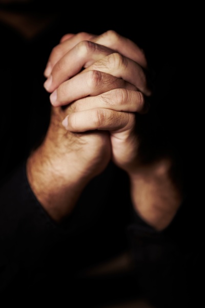 praying hard for redemption hands