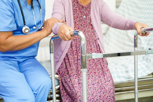 caregiver help asian elderly woman disability