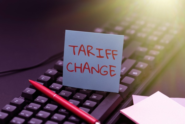 hand writing sign tariff change
