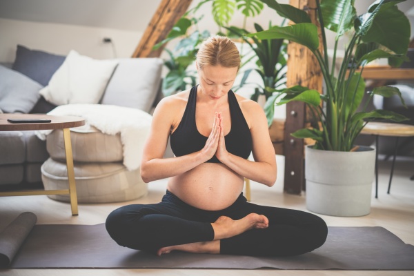 young beautiful pregnant woman training yoga