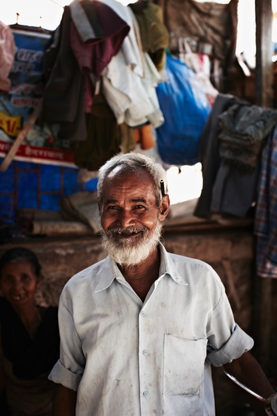smiling older man standing outdoors