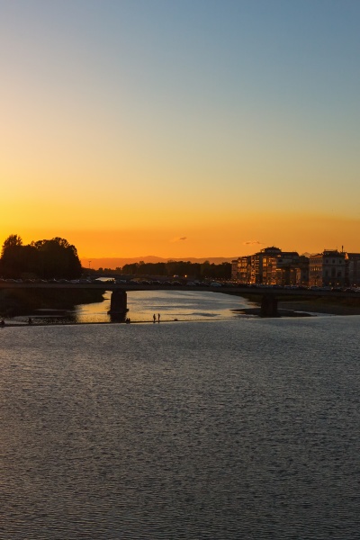 sunset over the river in florence