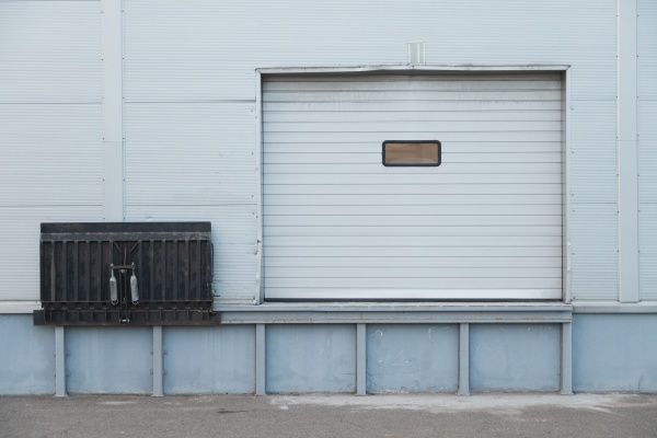 facade of modern warehouse with gate