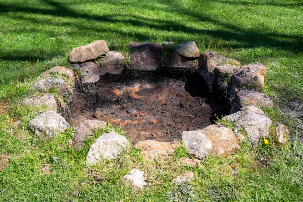 rustic stone circle fire pit in