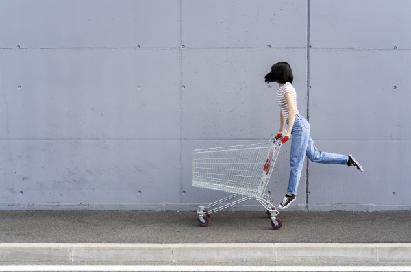young woman having fun with shopping