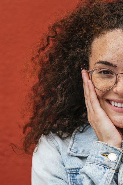 smiling young woman wearing eyeglasses in