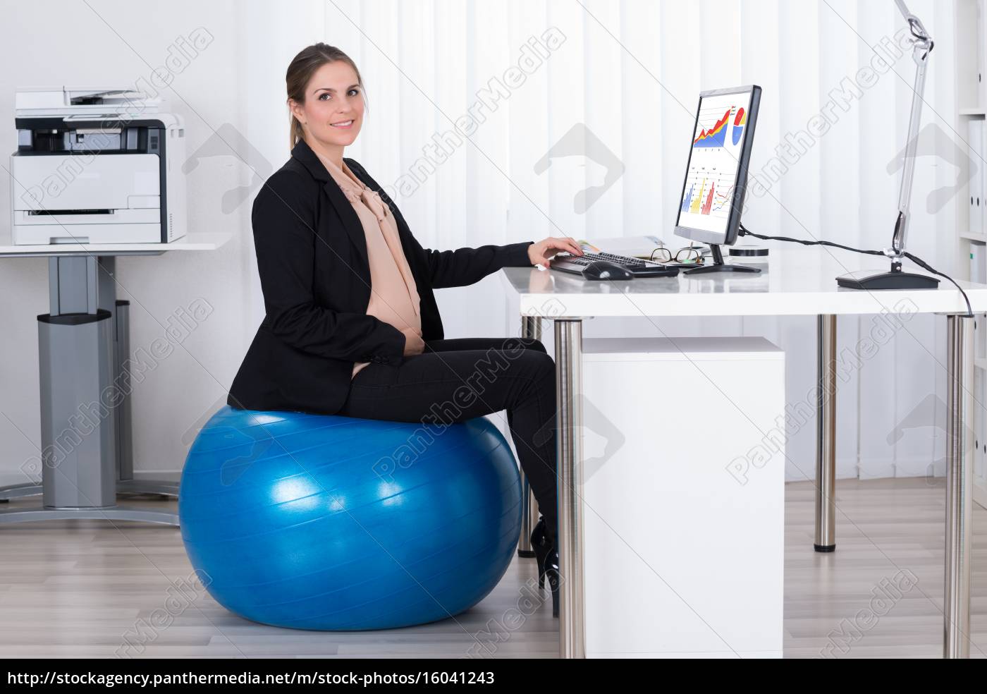 Pregnant Businesswoman Sitting On Fitness Ball Royalty Free