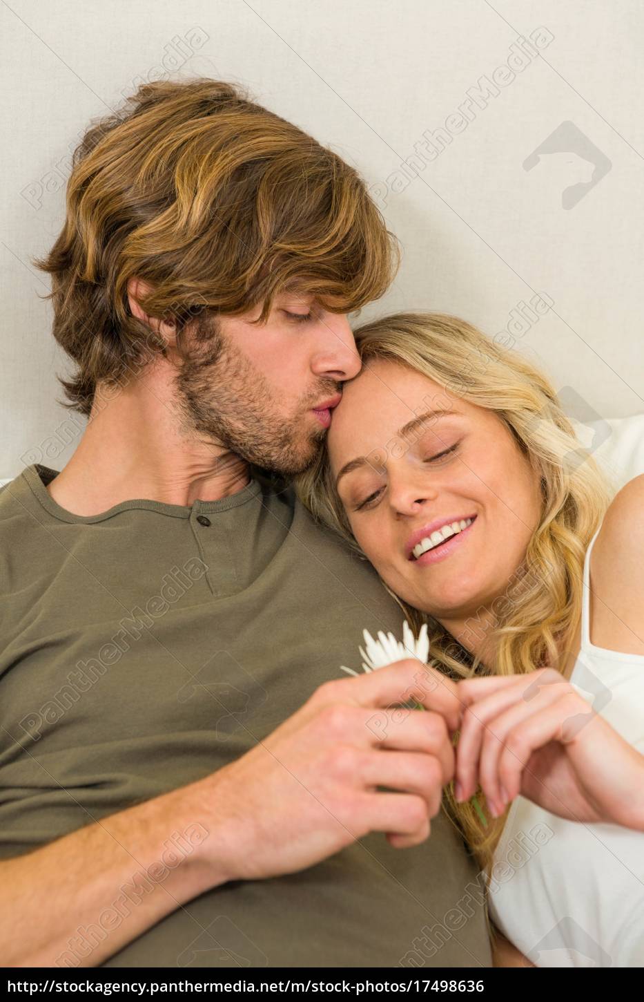 Royalty Free Photo 17498636 Cute Couple Cuddling On Their Bed