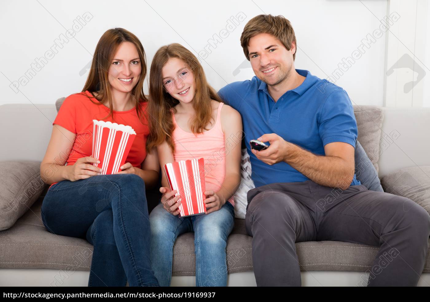 Family Sitting On Sofa Watching Television Royalty Free Image Panthermedia Stock Agency