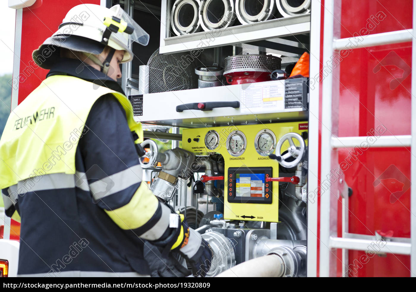 Firefighter at fire engine - Stock Photo - #19320809 | PantherMedia ...