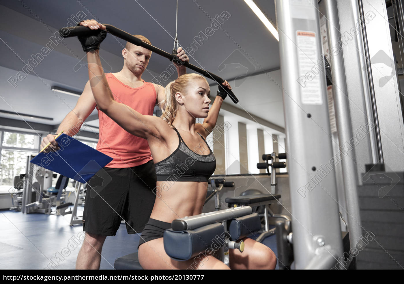Female Bodybuilder Flexing Muscles Stock Image - Image of machines