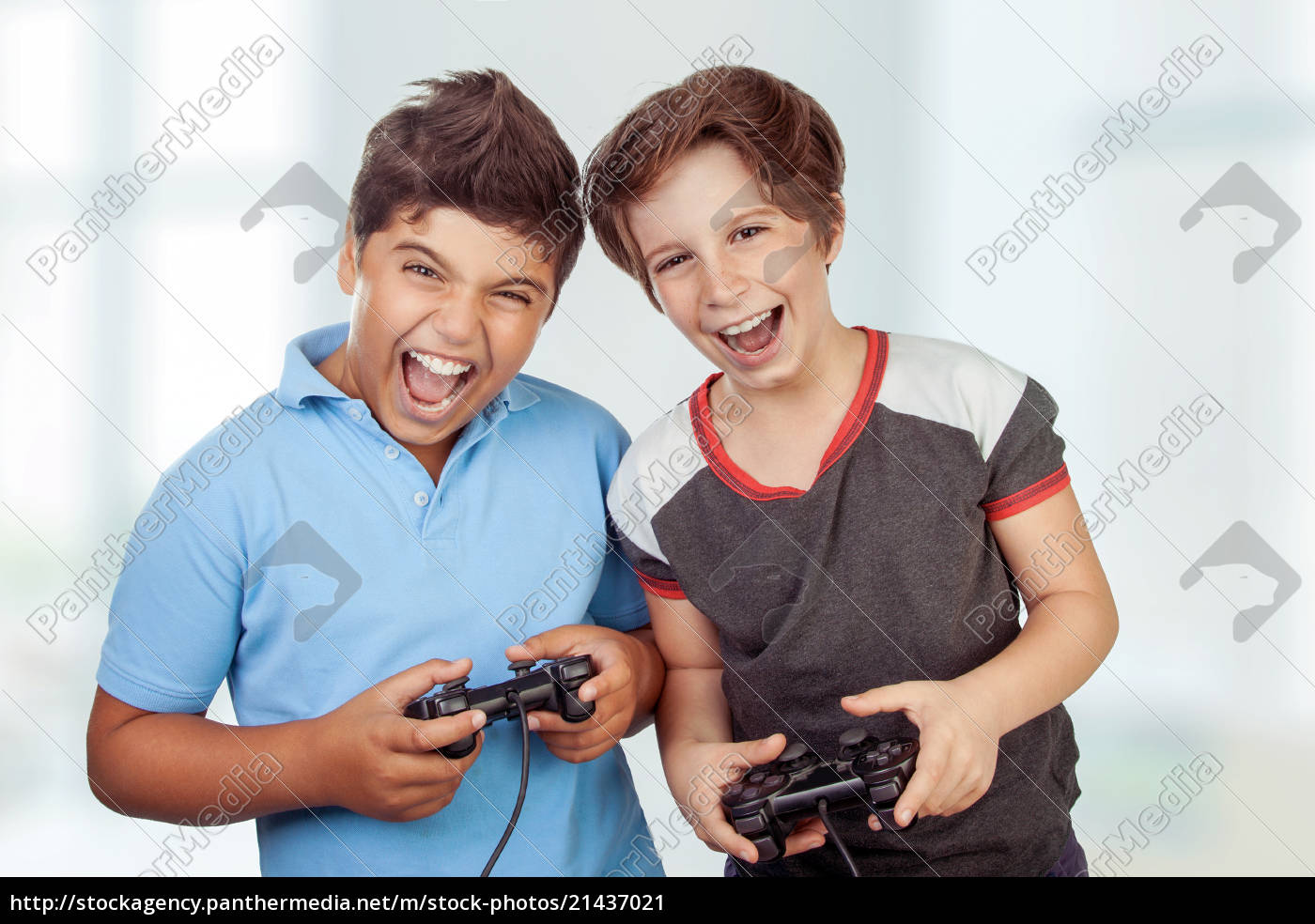 Best friends playing on playstation - Royalty free image #21436713