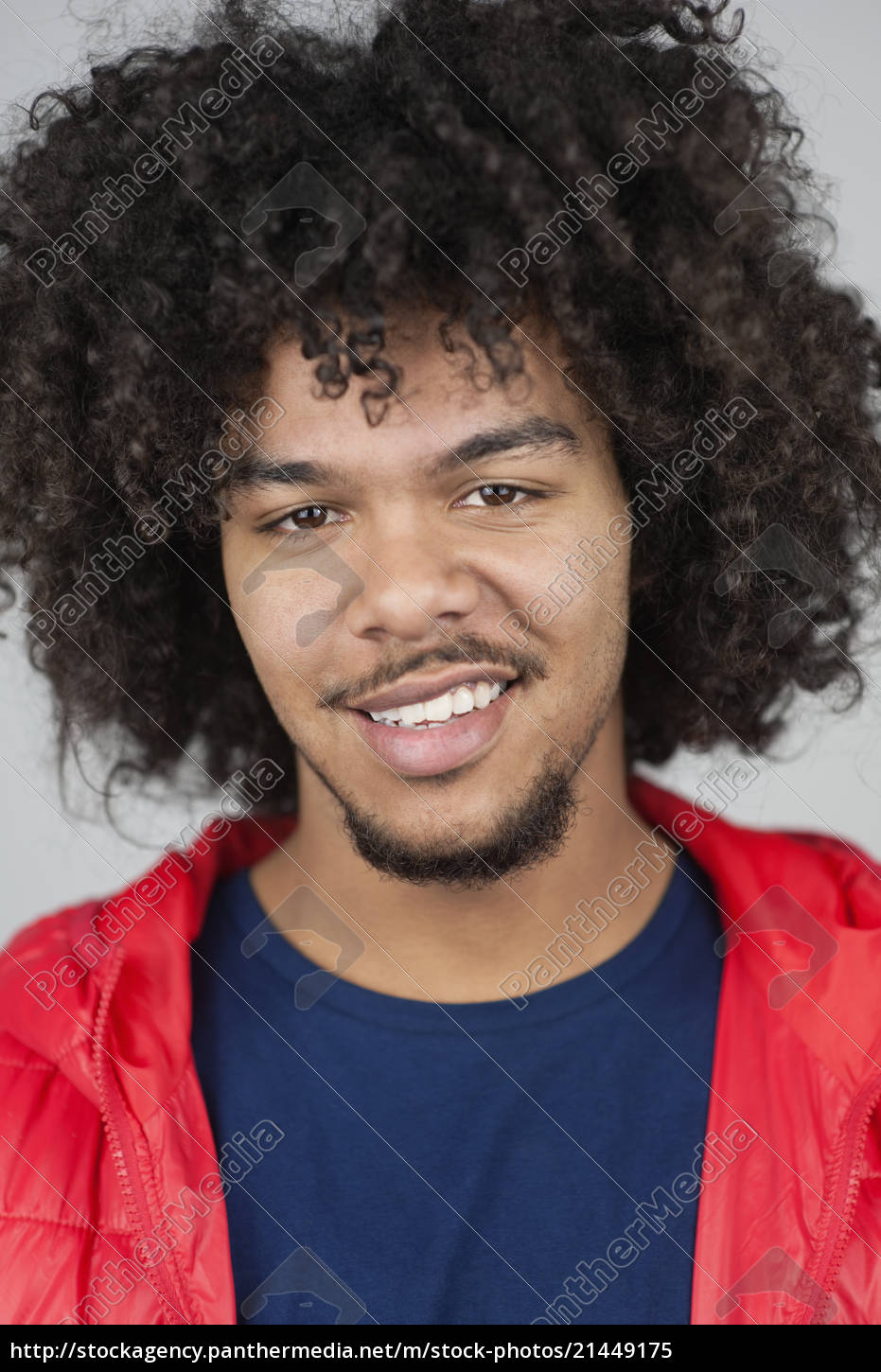 Portrait Of Happy Young Man With Curly Hair Royalty Free Image Panthermedia Stock Agency