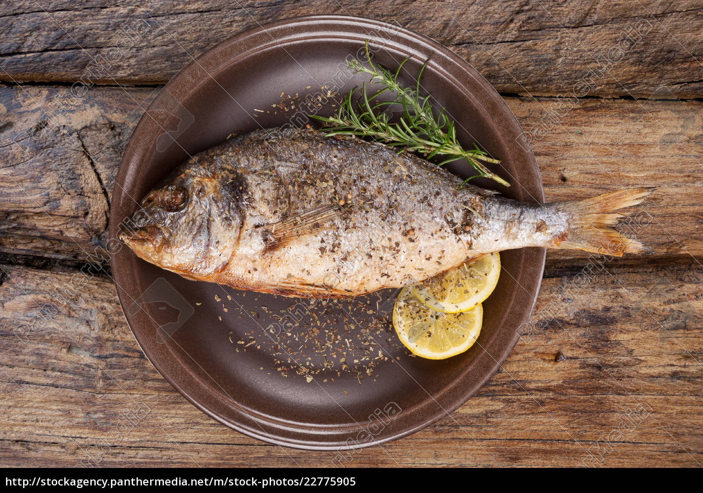 Seafood Eating Grilled Fish On Plate From Above Stock Photo Panthermedia Stock Agency