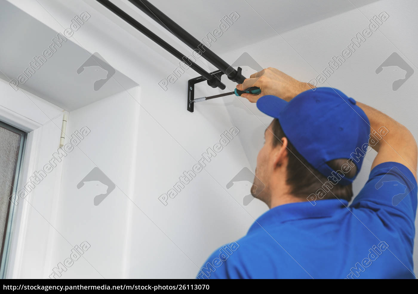 Handyman Services Worker Installing Window Curtain Stock Image 26113070 Panthermedia Stock Agency